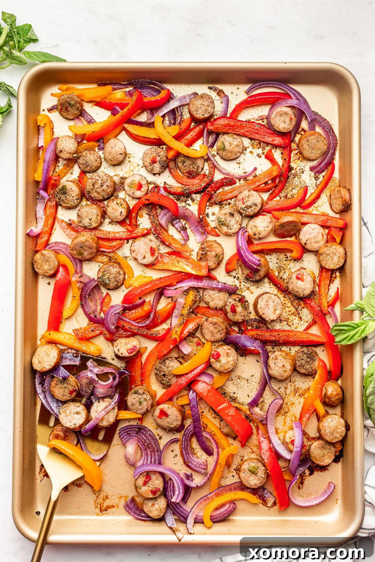 Effortless Roasted Italian Sausage and Peppers 5 Variety of colorful bell peppers and onions, ready for slicing.