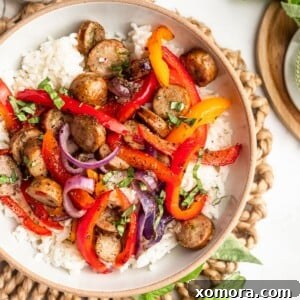 A close-up of the finished Sheet Pan Italian Sausage and Peppers, colorful and appealing.