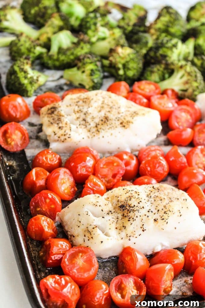 Zesty Tomato Basil Cod with Tender Broccoli 3 Close-up shot of raw cod filets ready for seasoning on a baking sheet, beside fresh broccoli florets.