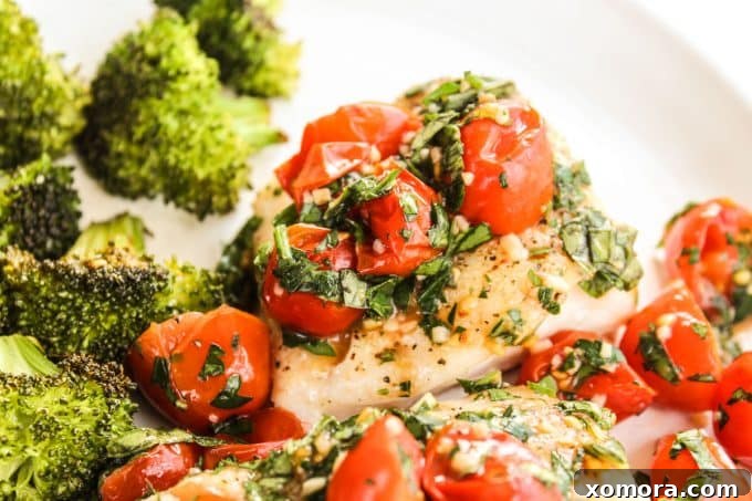 Zesty Tomato Basil Cod with Tender Broccoli 5 A serving of baked cod and broccoli with the tomato basil topping, ready to be enjoyed.