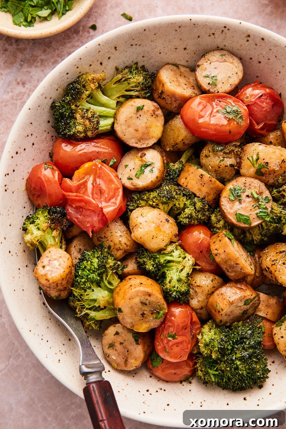 Cauliflower Gnocchi & Sausage Bake 2 Sheet pan meal with roasted Trader Joe's cauliflower gnocchi, broccoli, tomatoes, and sausage.