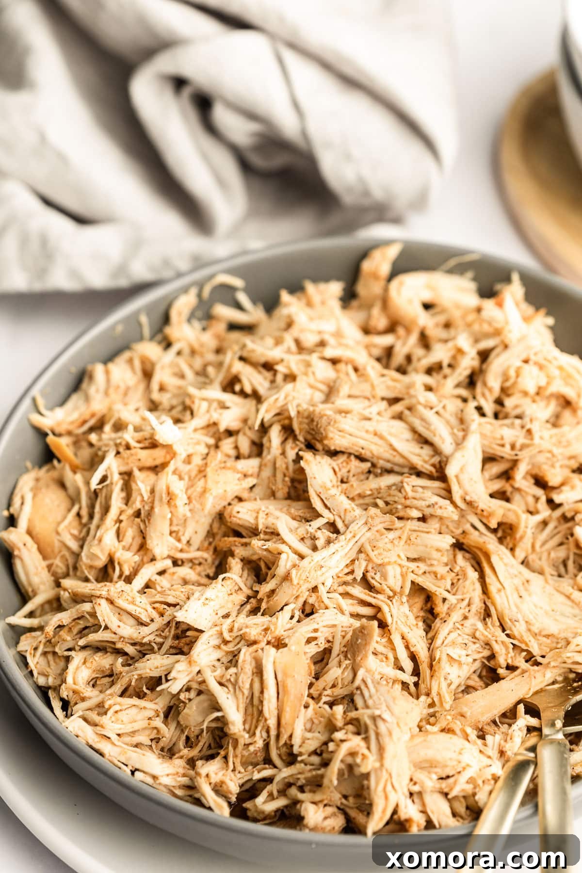 Effortless Slow Cooker Pulled Chicken 2 Cooked slow cooker shredded chicken in a bowl