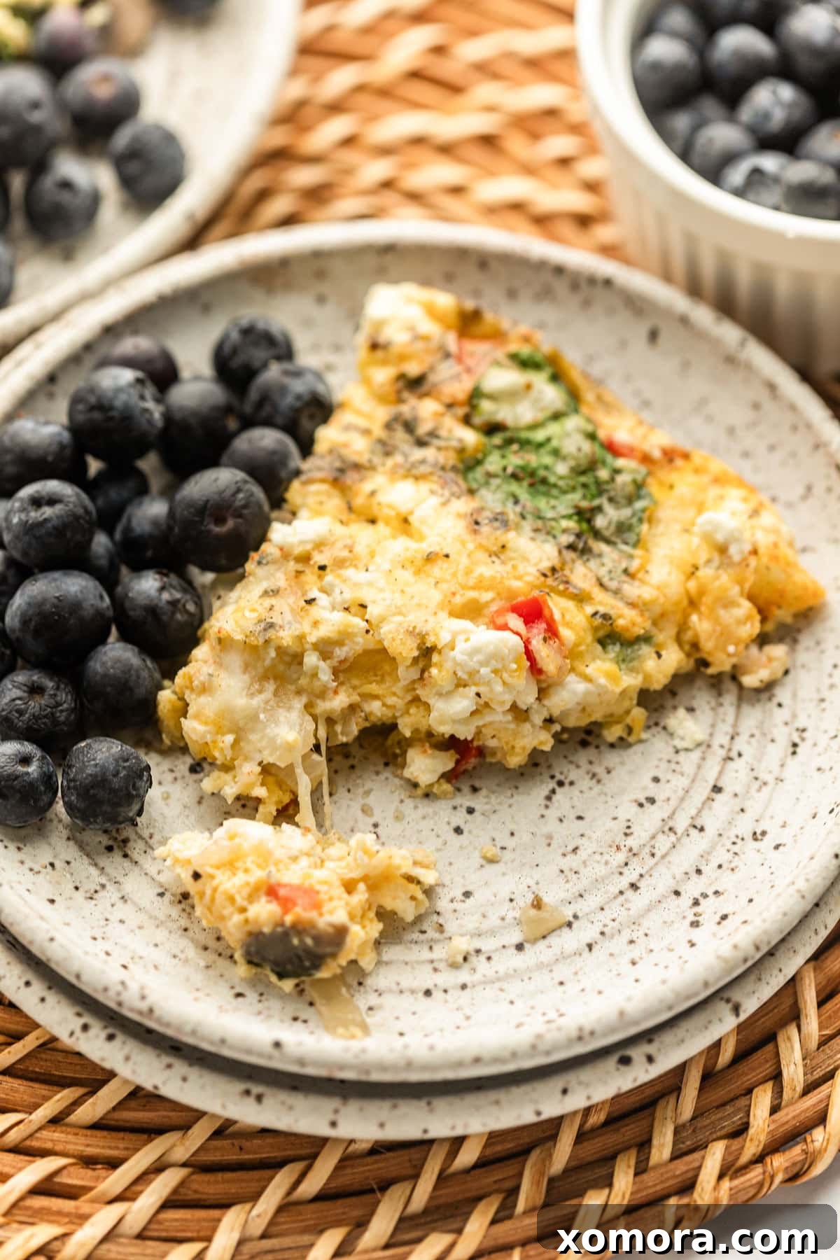 Vegetable Frittata baking in a cast iron skillet, golden brown and fluffy.
