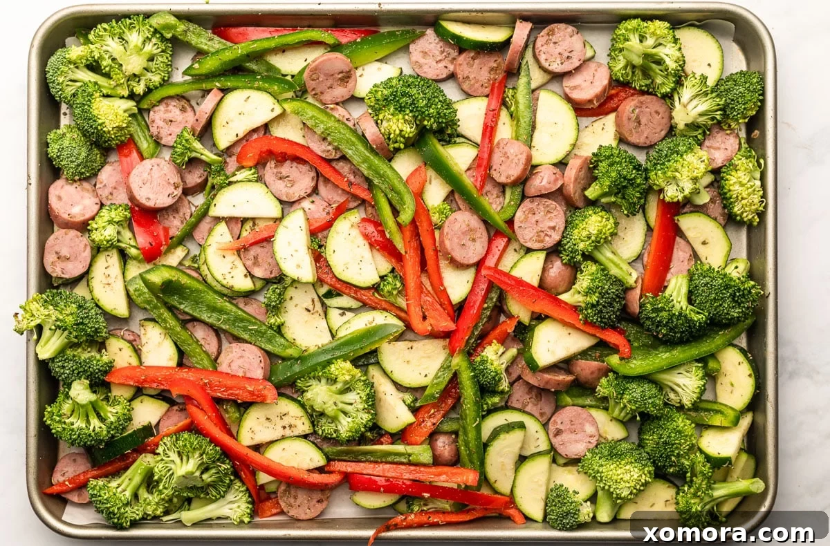 One Pan Sausage Zucchini Broccoli Dinner 4 A close-up of the sheet pan dinner after baking, with perfectly roasted vegetables and sausage.