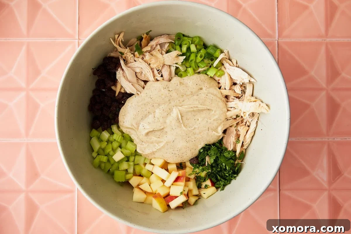 Zesty Greek Yogurt Curry Chicken Salad 4 All the fresh ingredients for Healthy Curry Chicken Salad beautifully mixed in a bowl.