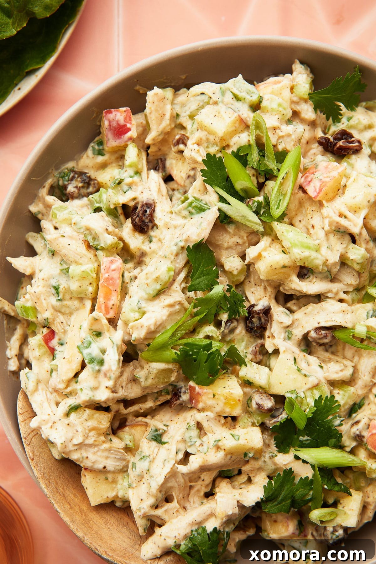 Zesty Greek Yogurt Curry Chicken Salad 5 Various fresh ingredients like cilantro, green onions, and essential spices laid out for curry chicken salad preparation.