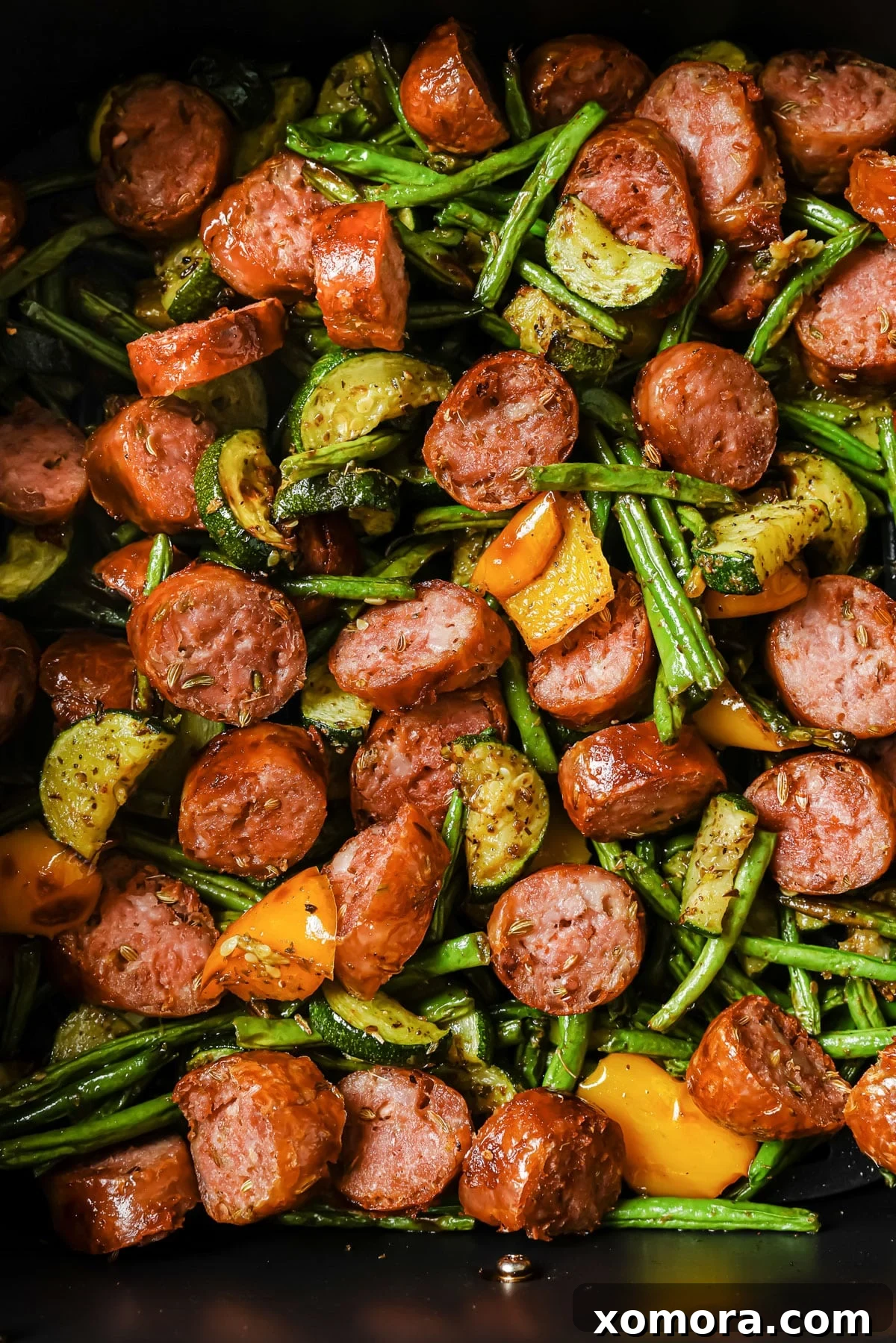Crispy Air Fryer Sausage and Roasted Vegetables 6 Cooked air fryer sausage and vegetables in a serving dish