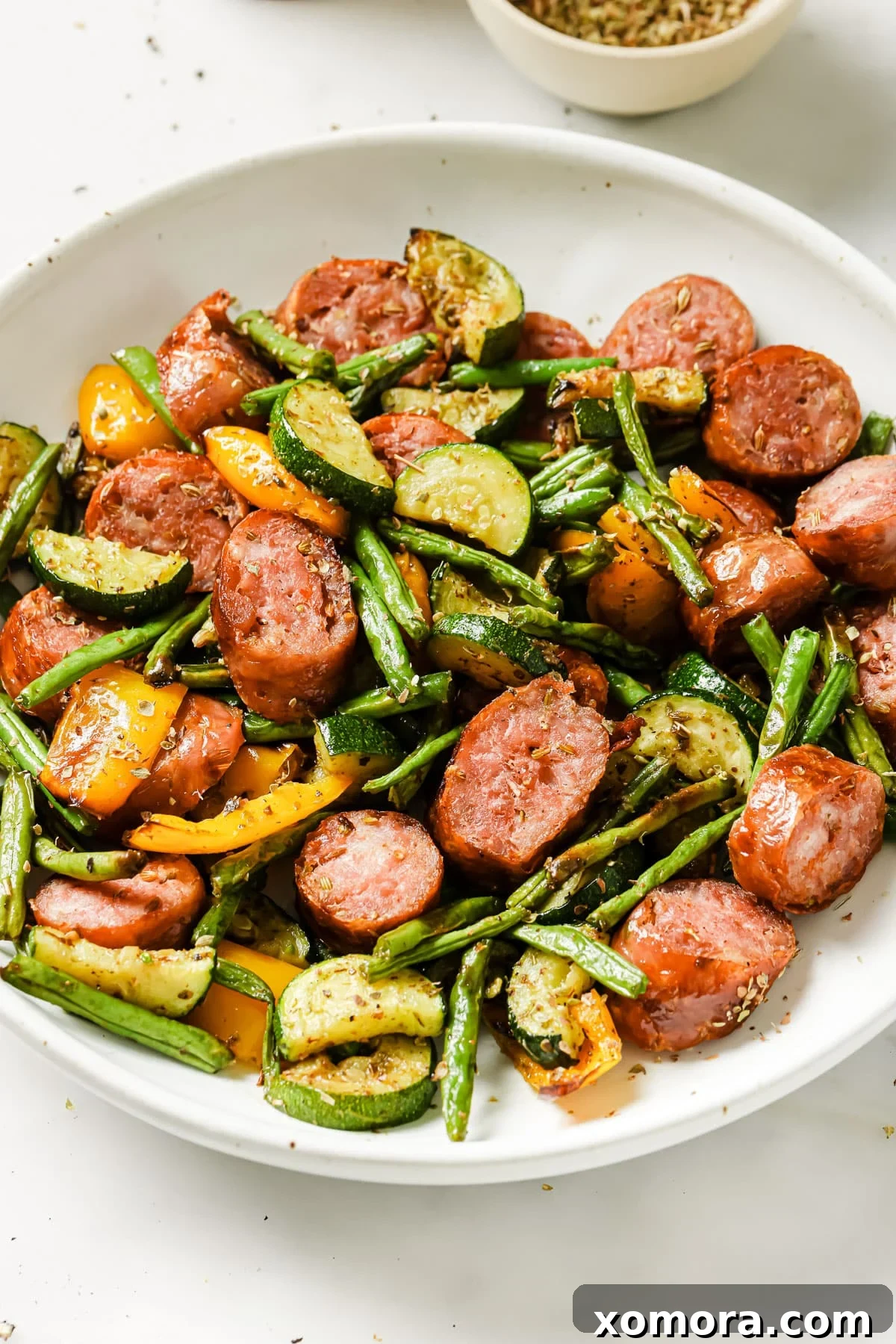 Crispy Air Fryer Sausage and Roasted Vegetables 7 Air fryer sausage and vegetables served with a side salad