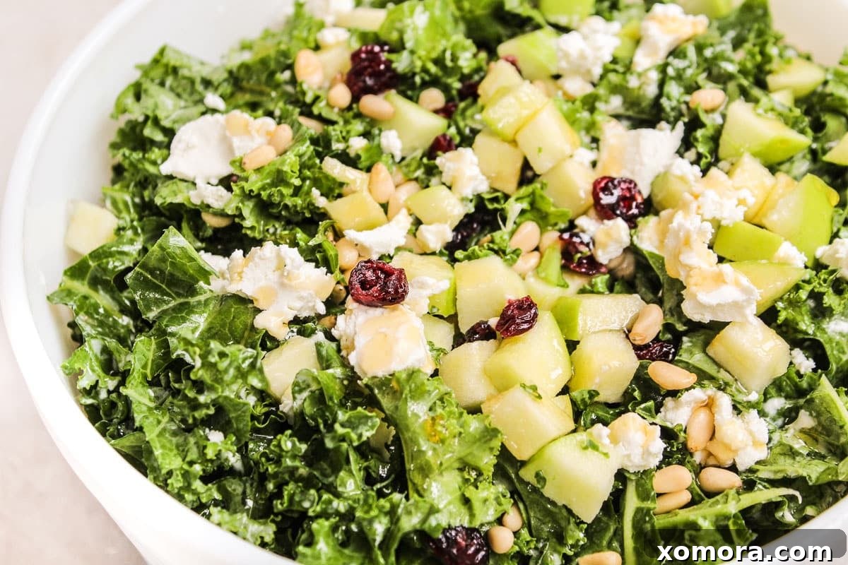 A serving of Easy Kale Salad with the ingredients clearly visible, ready to be enjoyed.