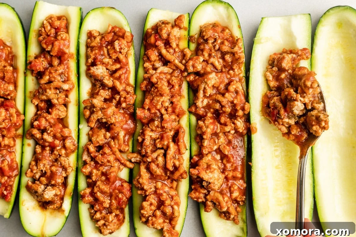 Stuffed Zucchini Boats with Turkey Lasagna 4 Zucchini boats filled with turkey mixture, ready for the oven or just before adding cheese.