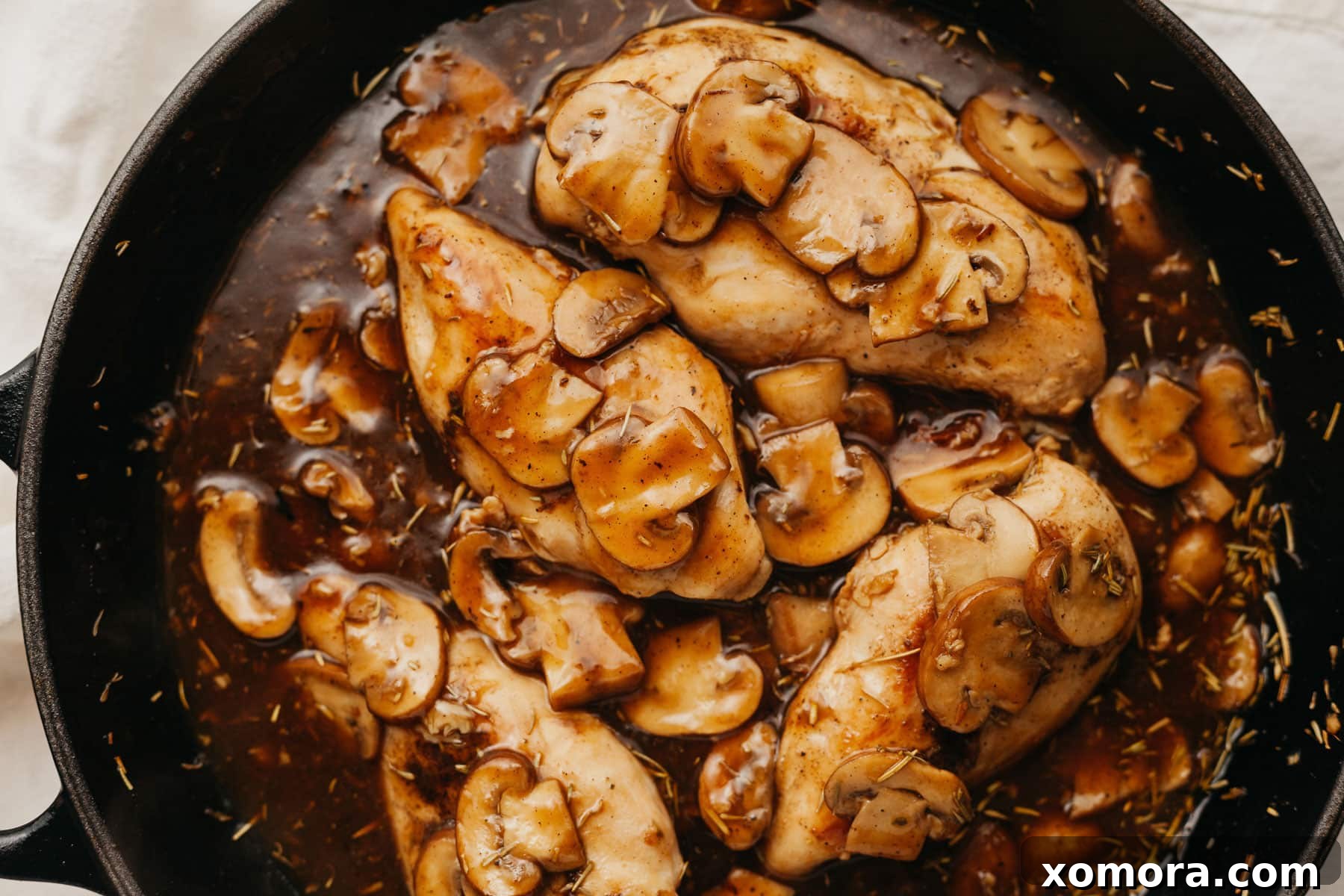 Guilt-Free Chicken Marsala 6 A full plate of Healthy Chicken Marsala served with roasted vegetables, ready to eat.