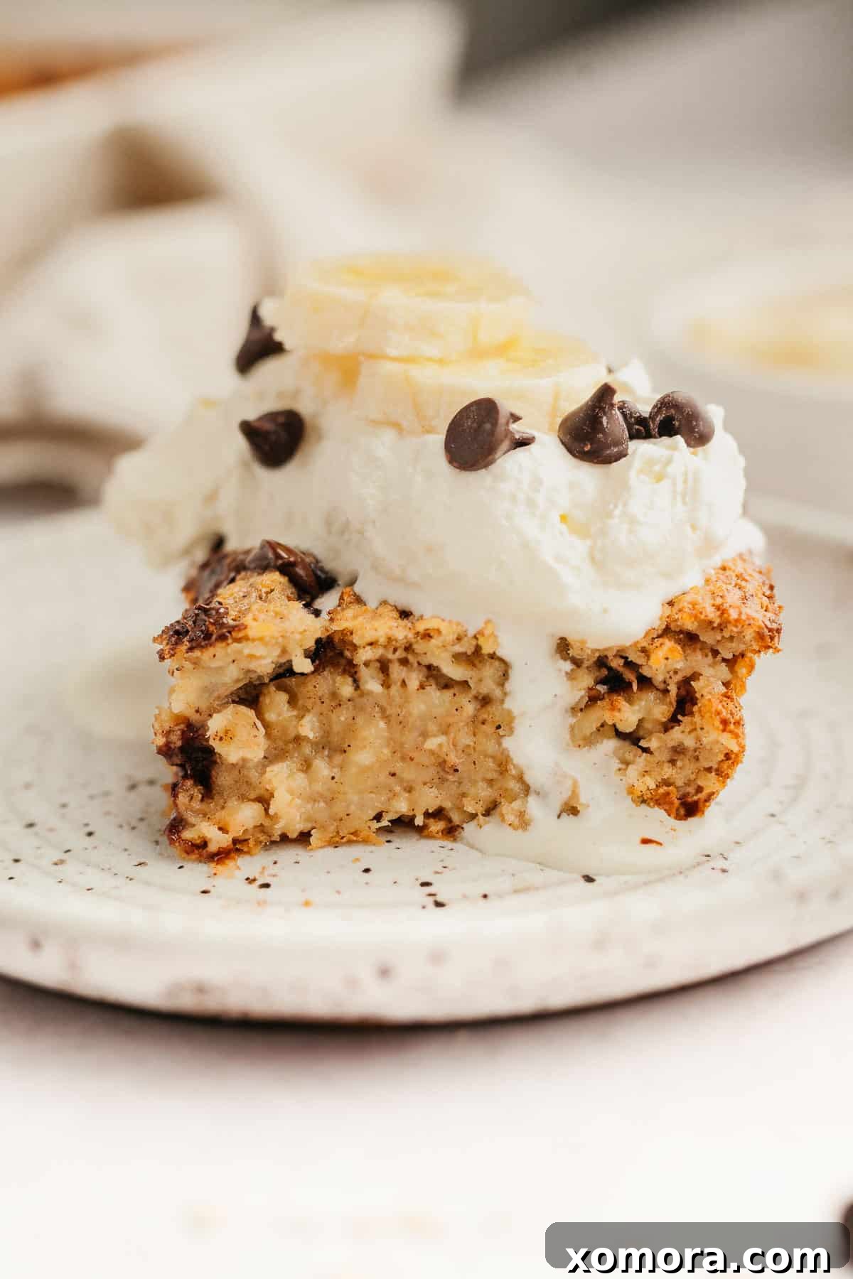 Warm Banana Chocolate Chip Baked Oats 2 Freshly baked banana chocolate chip oatmeal in a baking dish