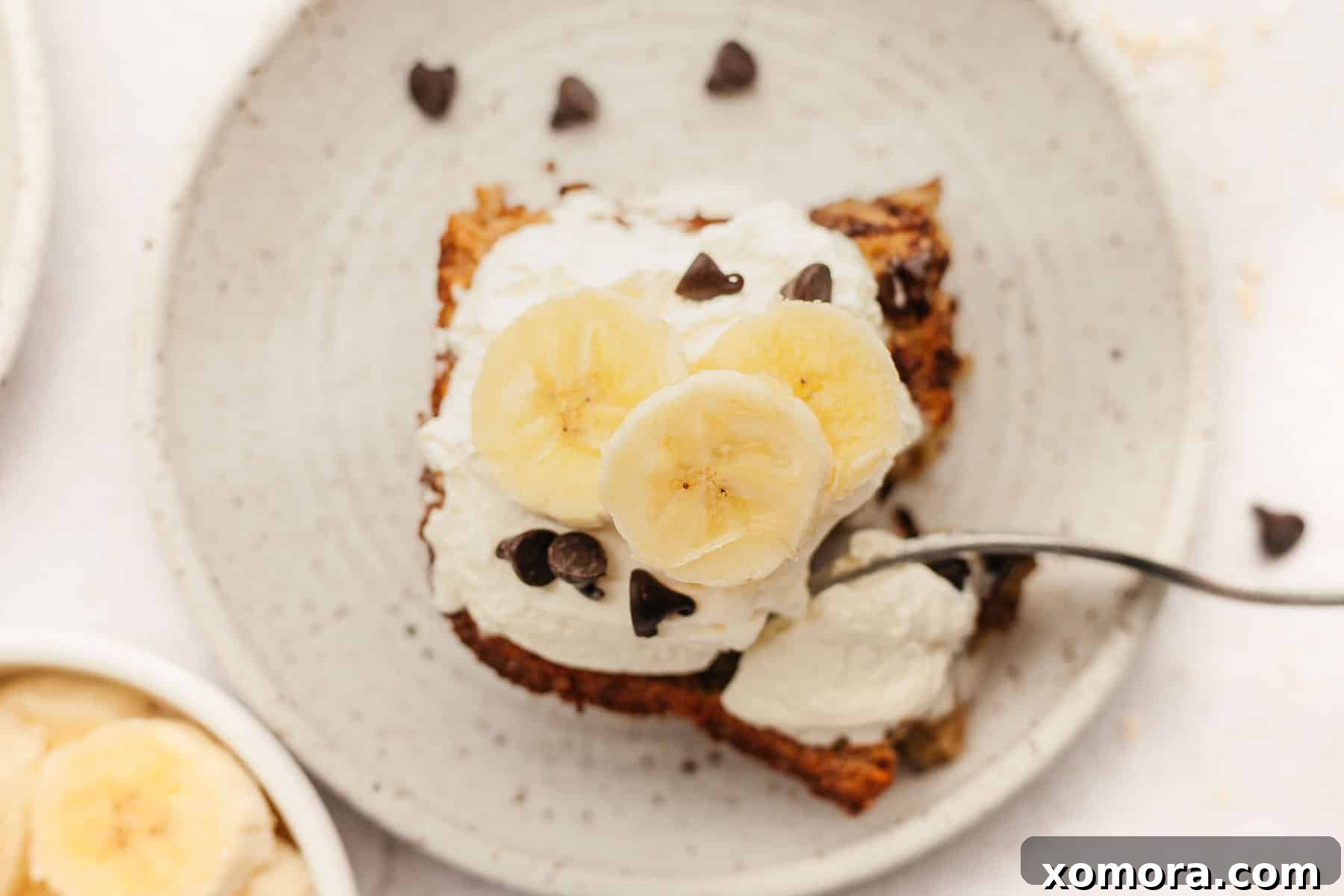 Warm Banana Chocolate Chip Baked Oats 6 Tray of freshly baked banana chocolate chip oatmeal squares