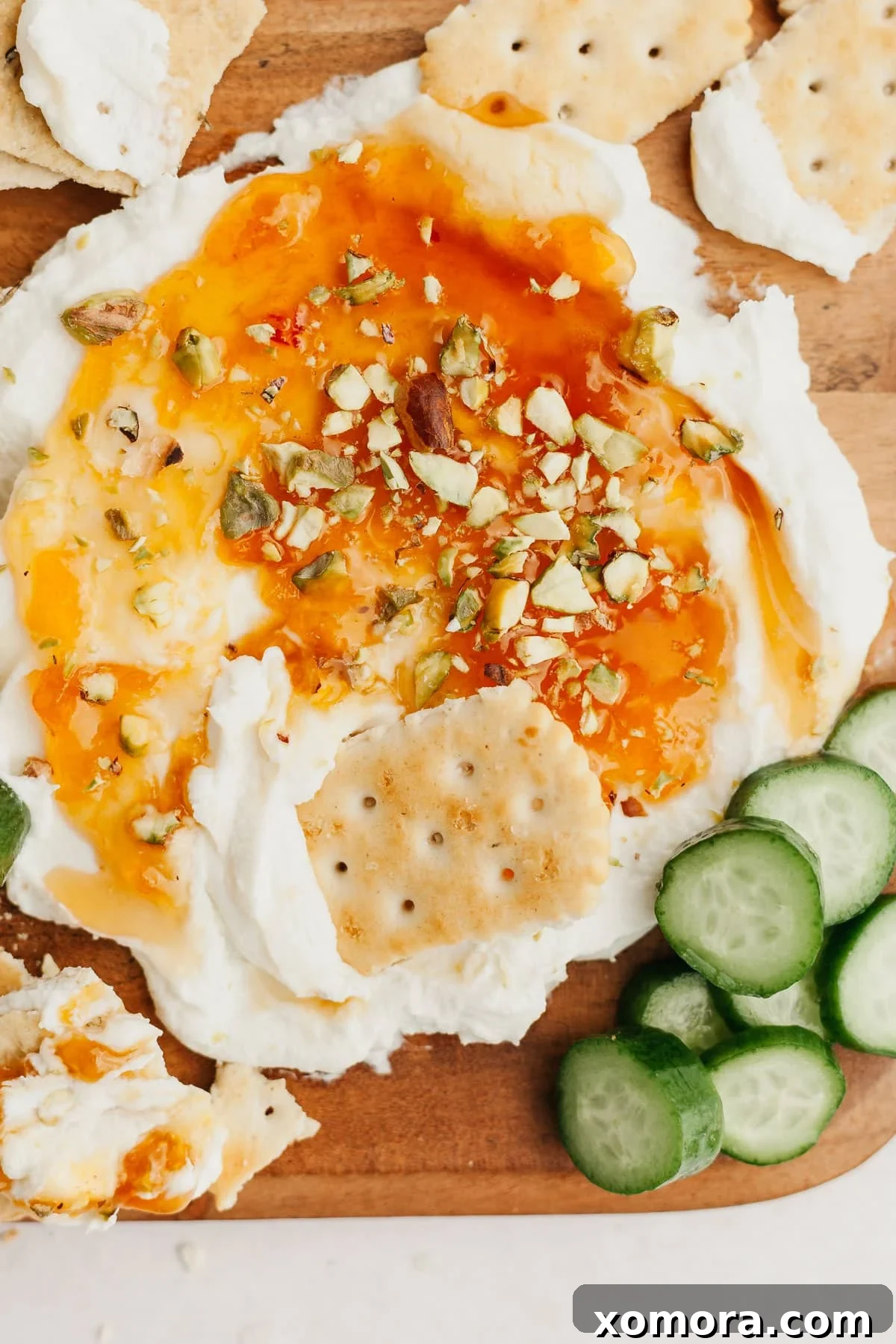 Apricot Goat Cheese Spread served on a board with crackers