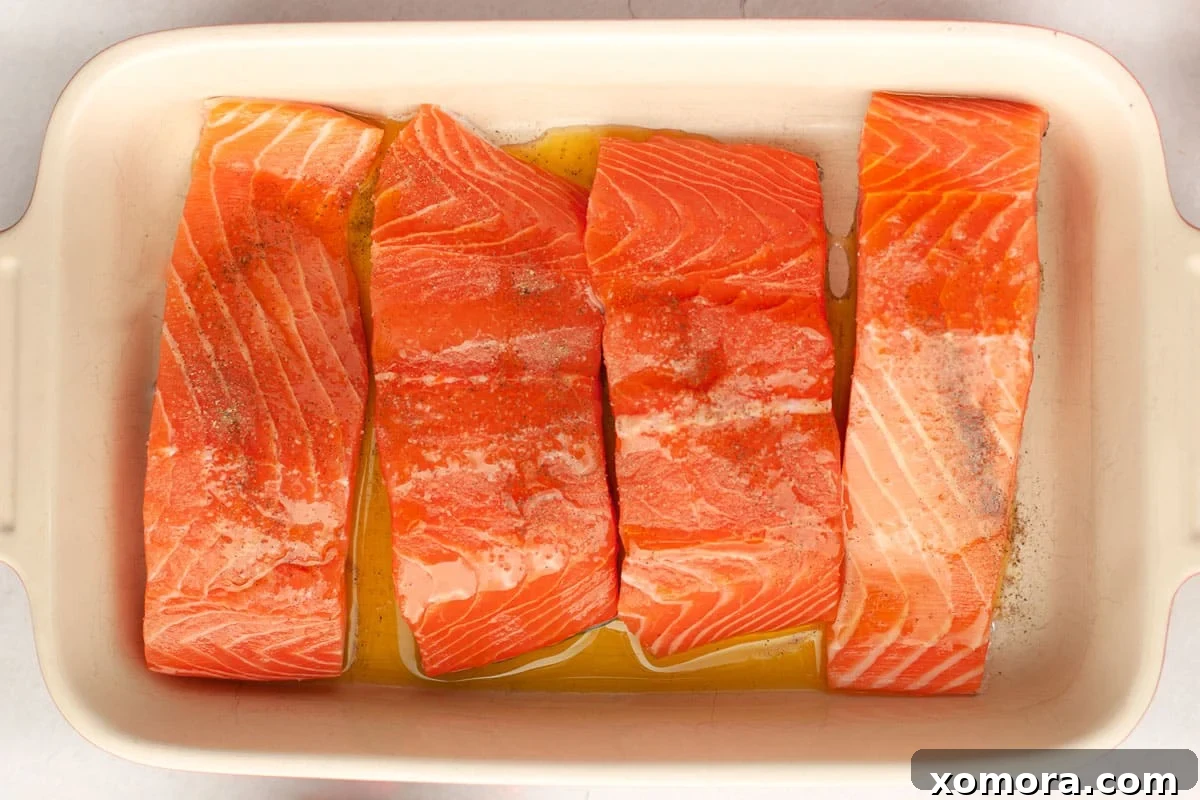 Deliciously Simple Lemon Dill Oven Salmon 5 Cooked salmon fillet showing flaky texture and vibrant color.