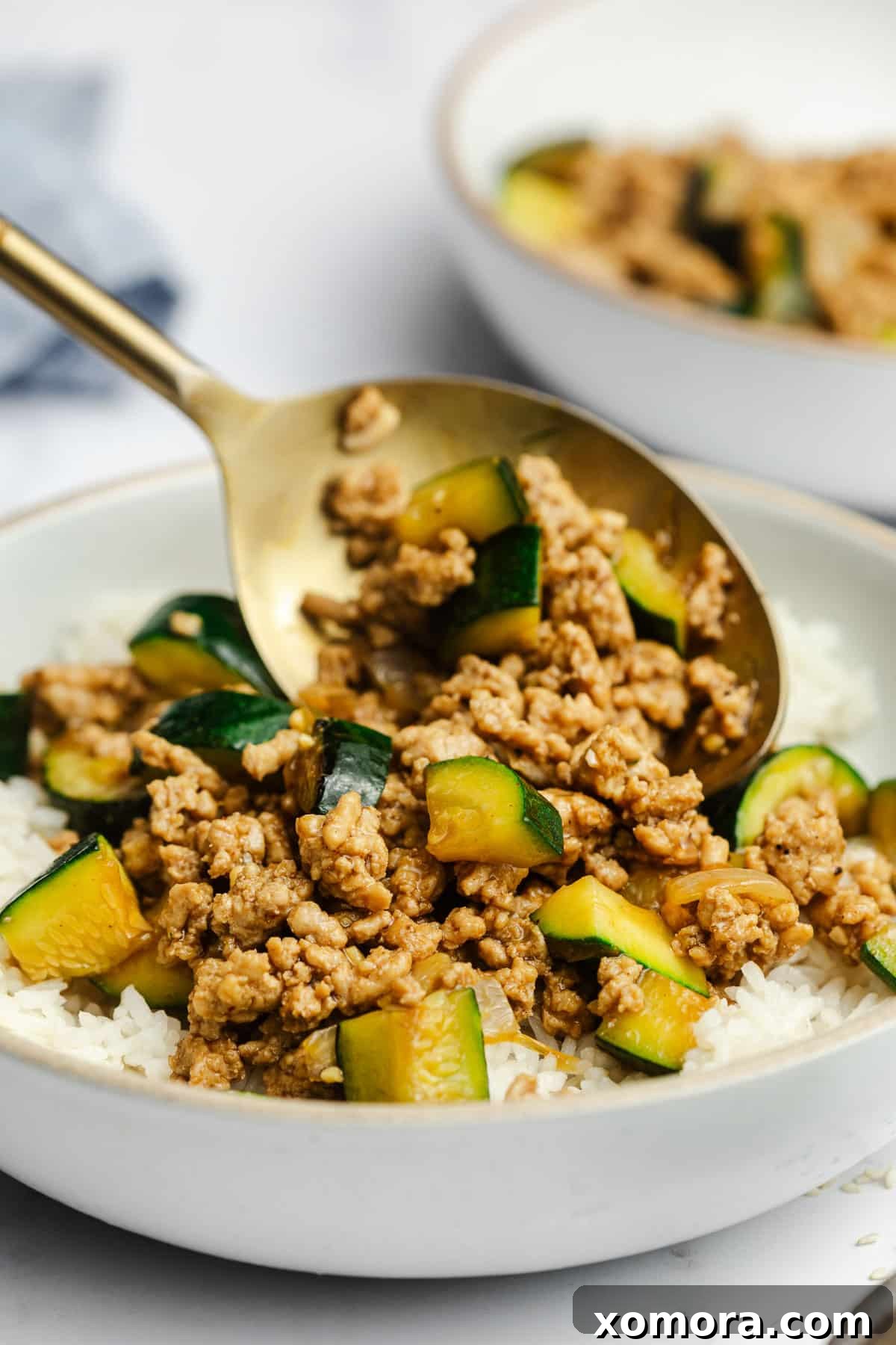 Flavorful Ground Chicken Zucchini Stir-Fry 5 A large serving of Ground Chicken and Zucchini Stir Fry in a bowl, ready to be enjoyed.