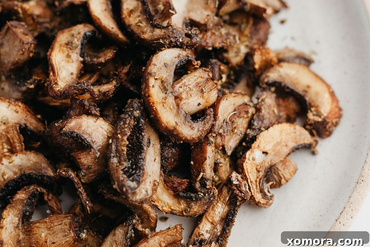 Simple Air Fryer Mushroom Perfection 5 A bowl of freshly air-fried sliced mushrooms, ready to be enjoyed