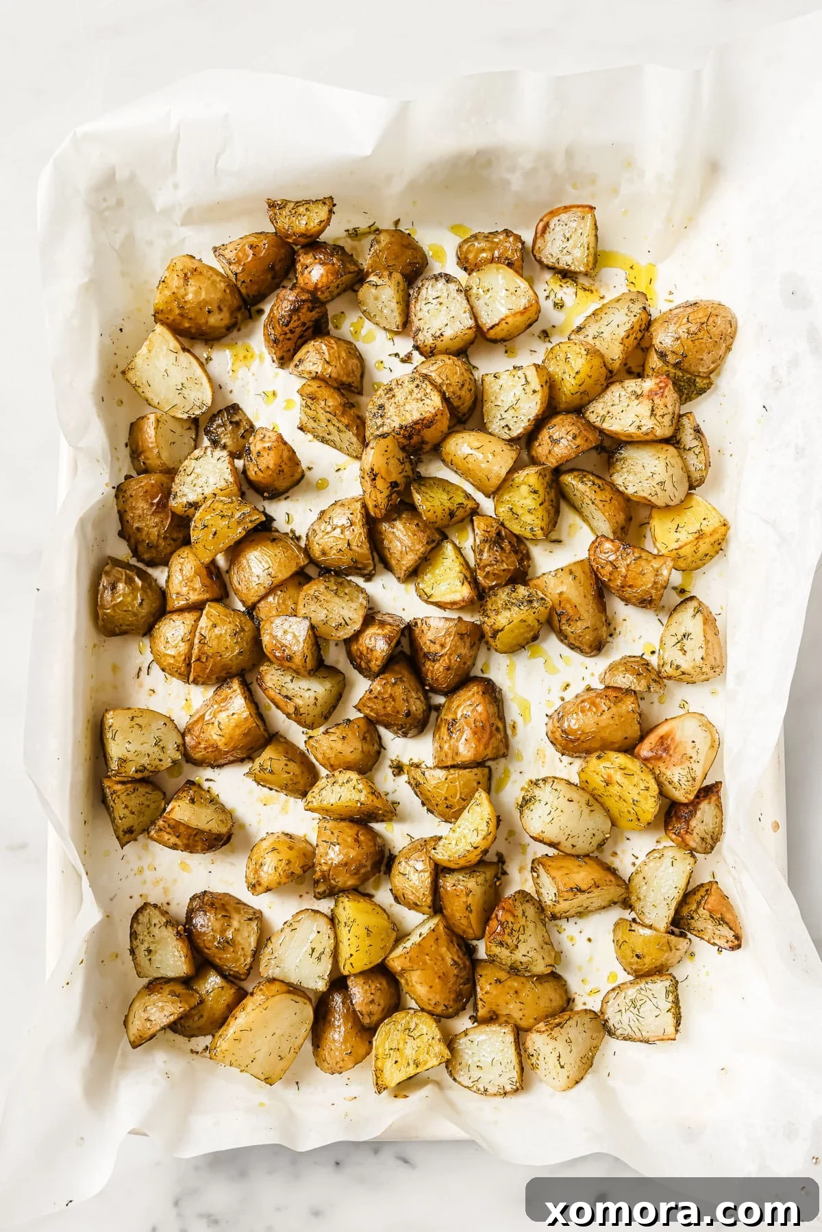 Close-up of roasted potatoes with arugula and feta, highlighting the textures