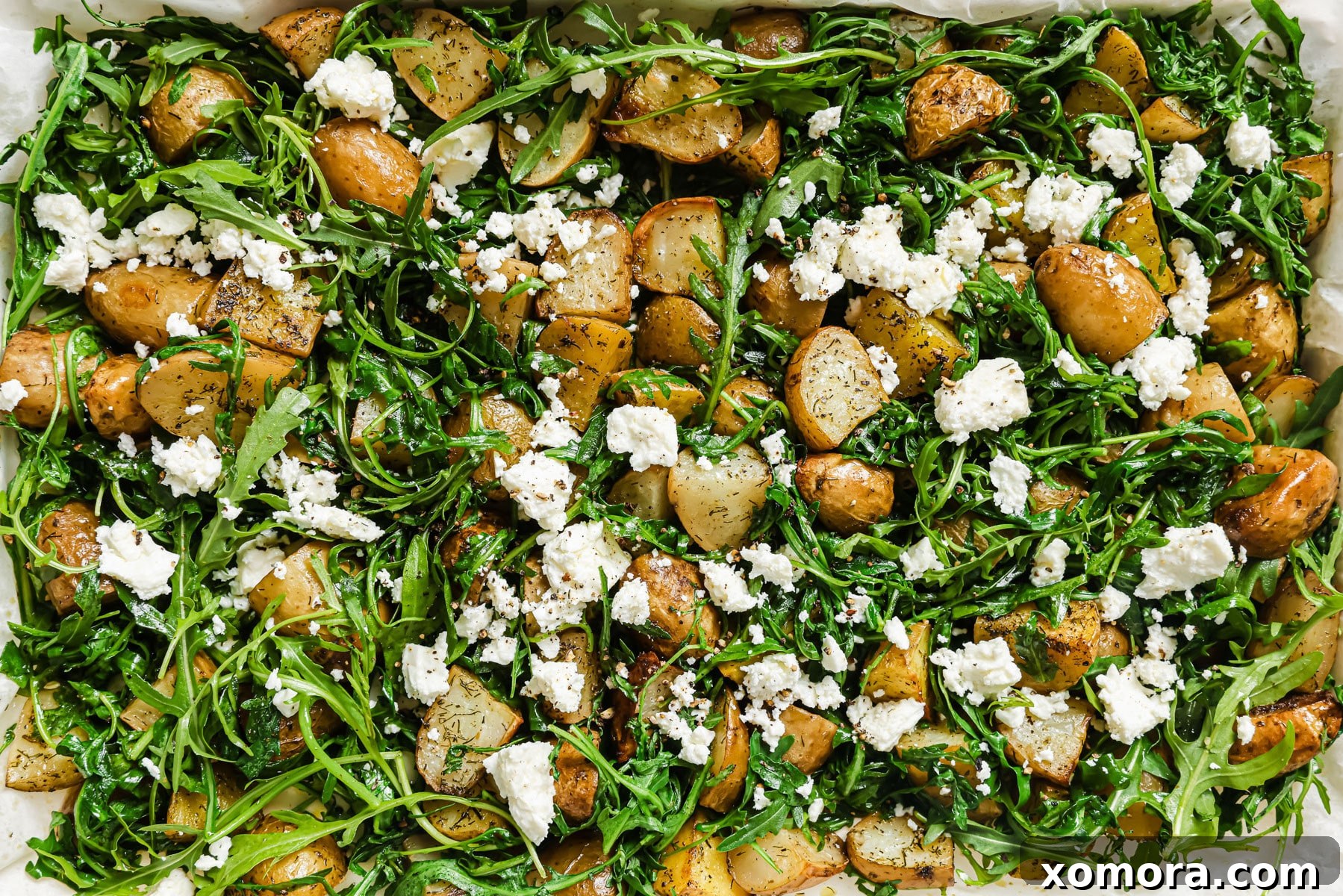 Roasted potatoes on a baking sheet, golden and crispy