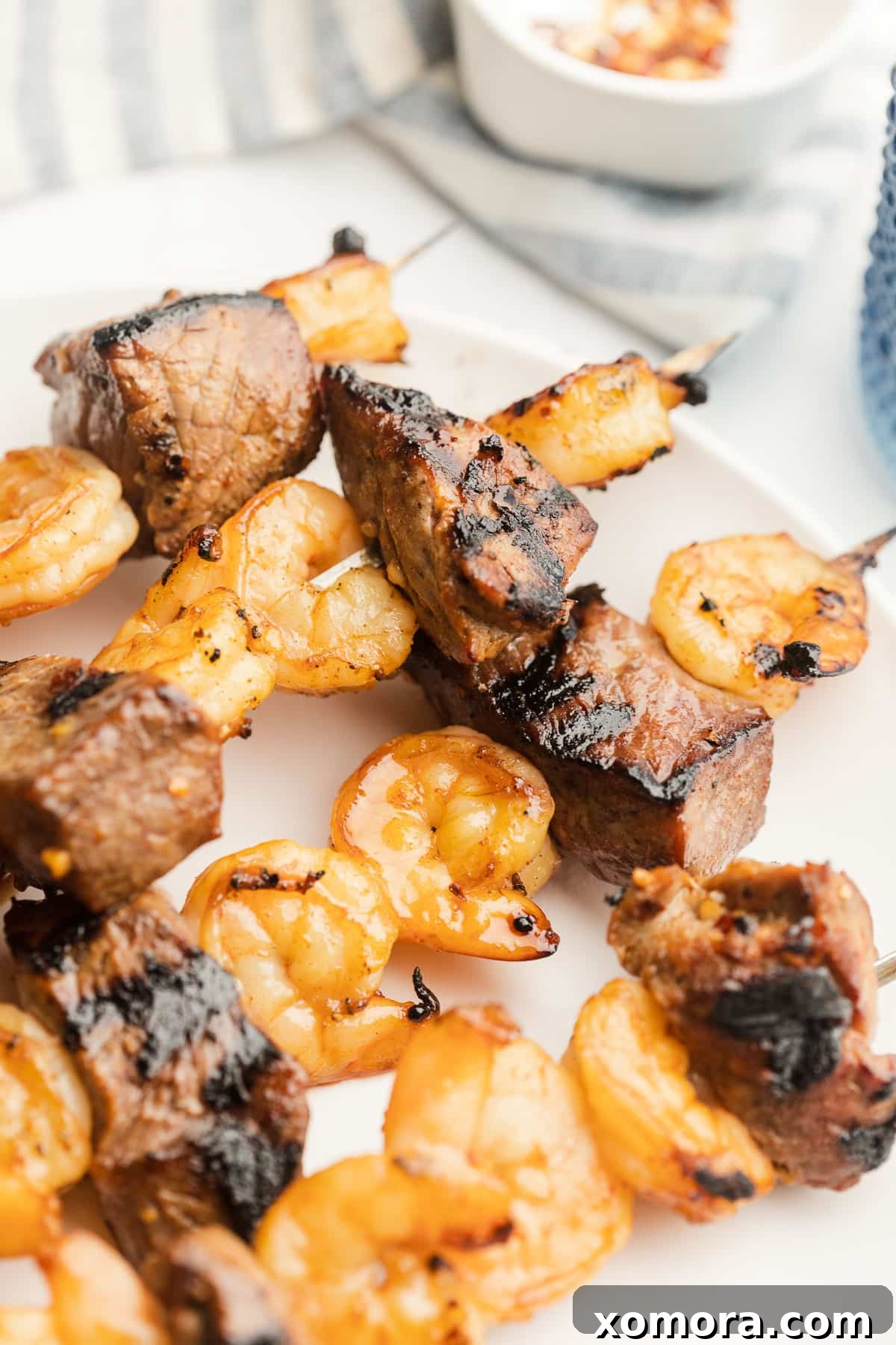 Surf and Turf Skewers 5 Close-up of a single grilled steak and shrimp kabob, perfectly charred.
