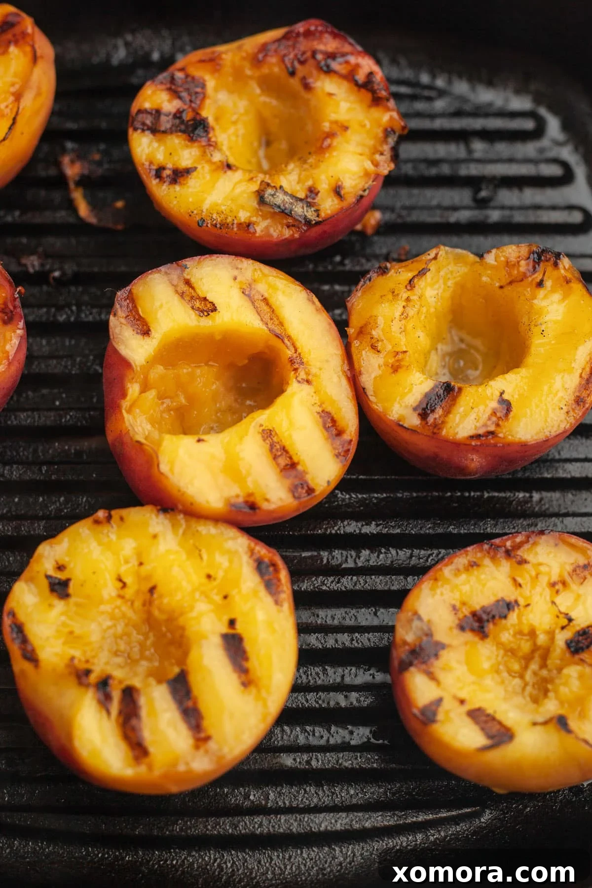 Caramelized Grilled Peaches with Creamy Vanilla 4 Grilled peaches with various topping suggestions, including nuts and other fruits
