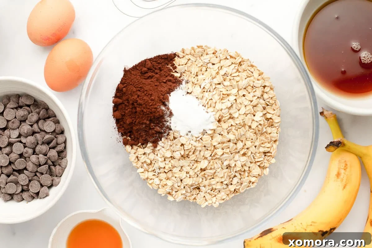 Fudgy Chocolate Baked Oats 3 Close-up of baked chocolate oatmeal ingredients being mixed