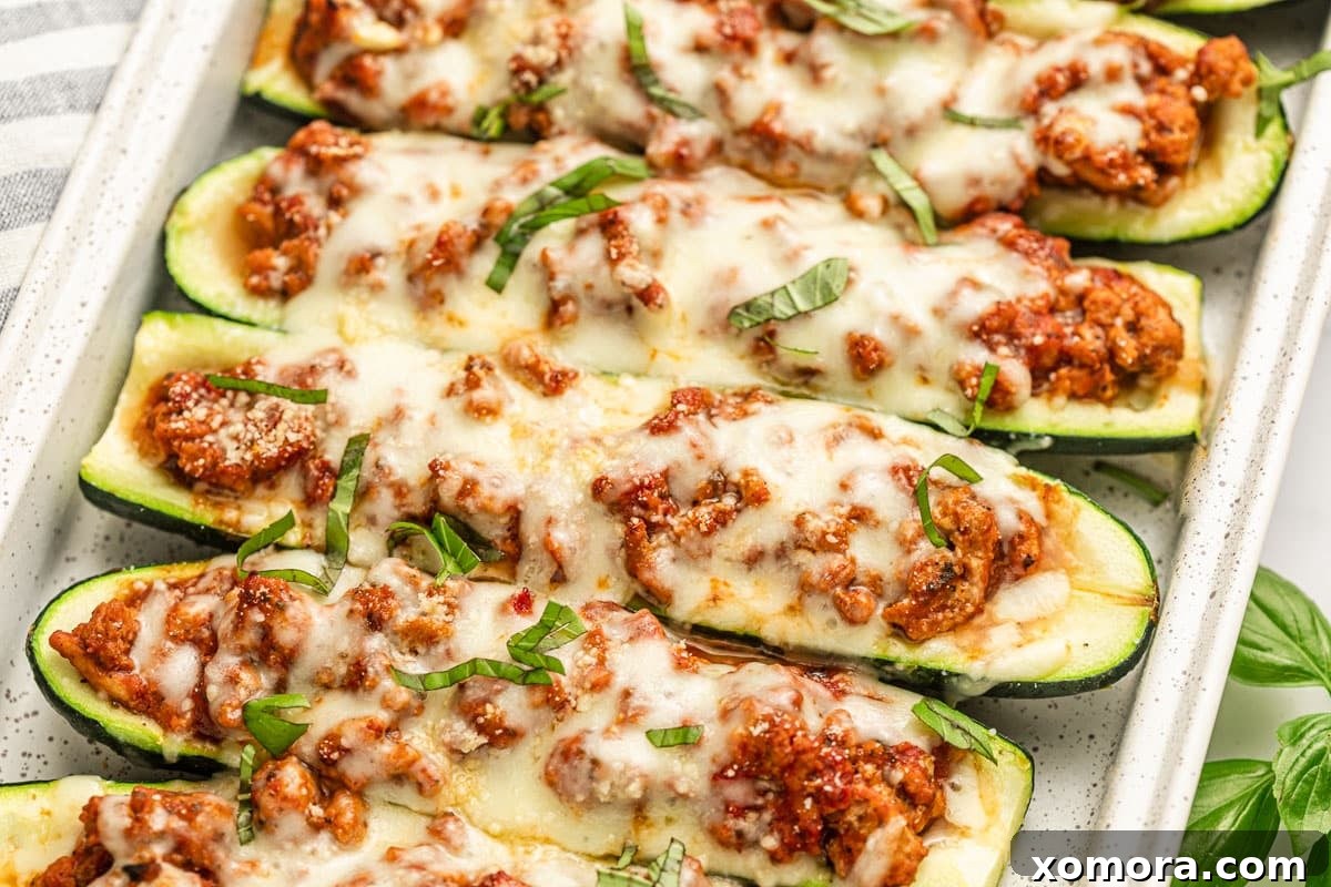 Turkey Lasagna Zucchini Boats topped with cheese