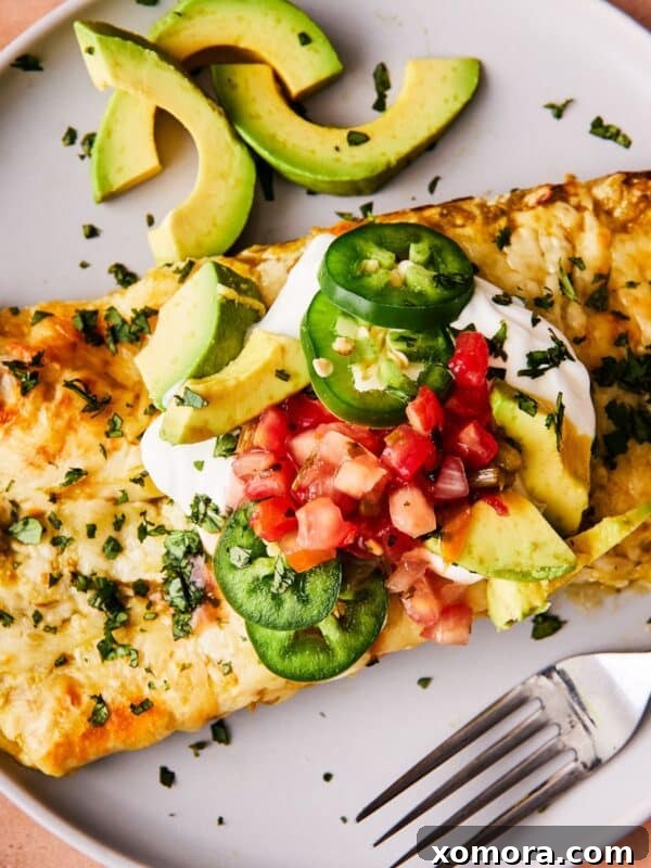 Easy Salsa Verde Chicken Enchiladas, garnished with fresh cilantro.