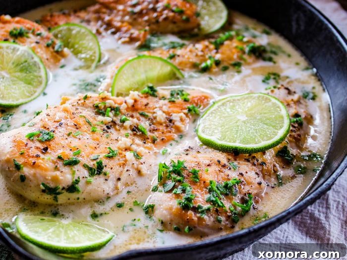 Coconut Lime Chicken, garnished with fresh lime and cilantro.