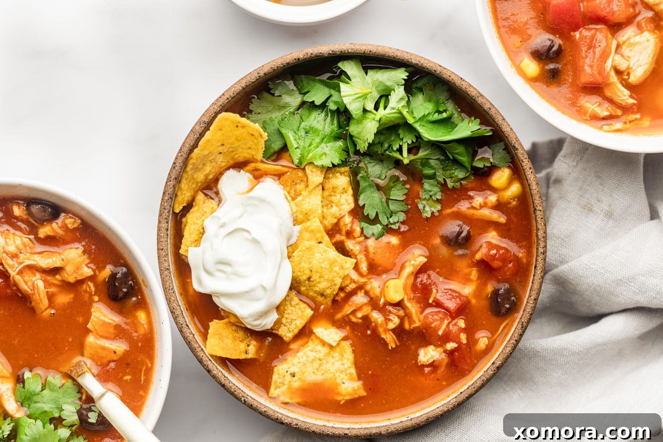 30 Minute Chicken Taco Soup, garnished with fresh cilantro and lime.