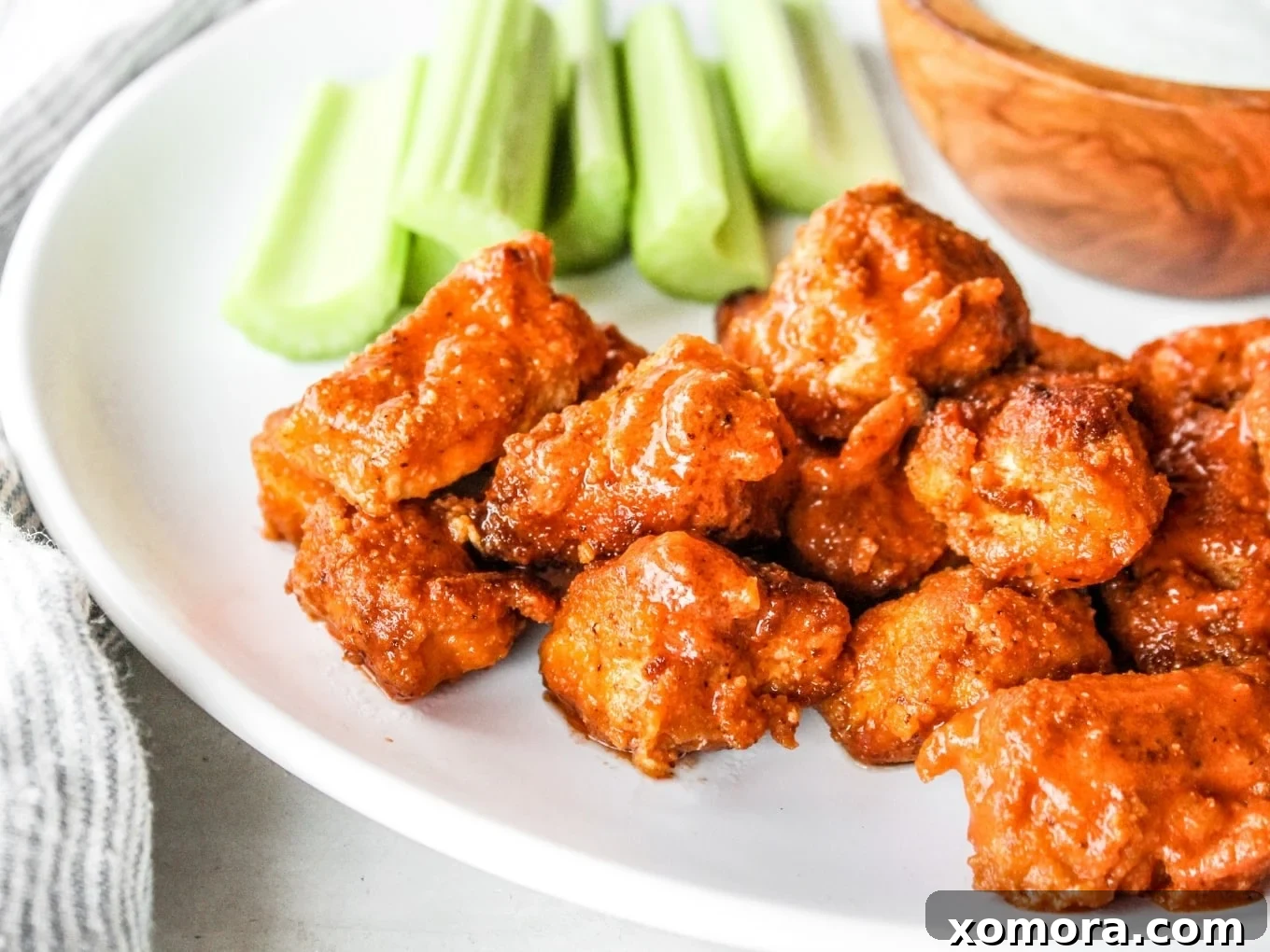 Buffalo Chicken Bites, coated in buffalo sauce with a crispy texture.
