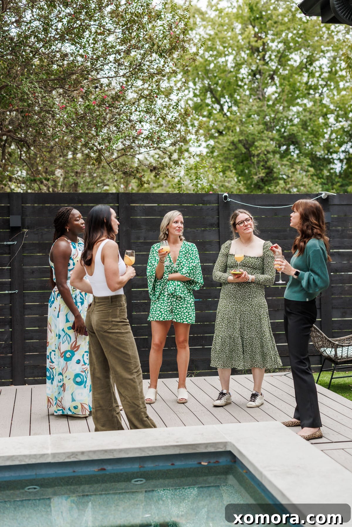 A candid photo of food bloggers interacting, perhaps during a discussion session or meal, showcasing the community aspect of the retreat.