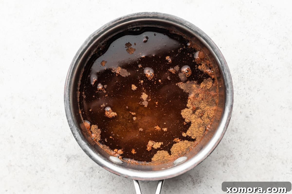 Crafting Brown Sugar Simple Syrup 4 Brown sugar simple syrup simmering in a small saucepan.