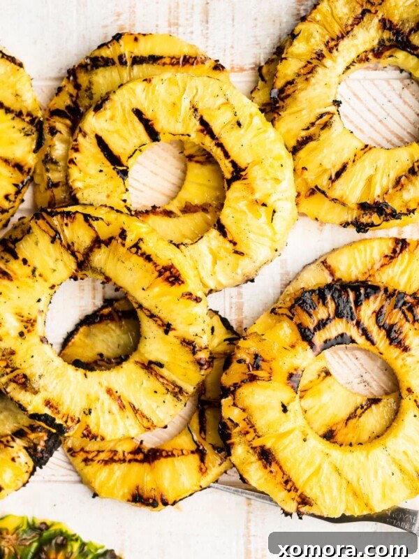Grilled Pineapple Slices, caramelized and juicy.