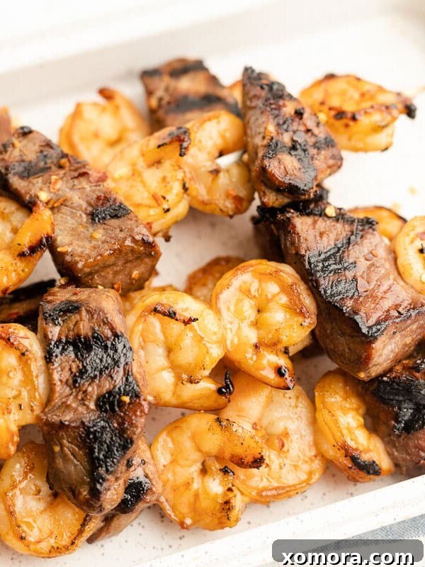 Steak and Shrimp Kabobs on a grill, perfectly cooked.