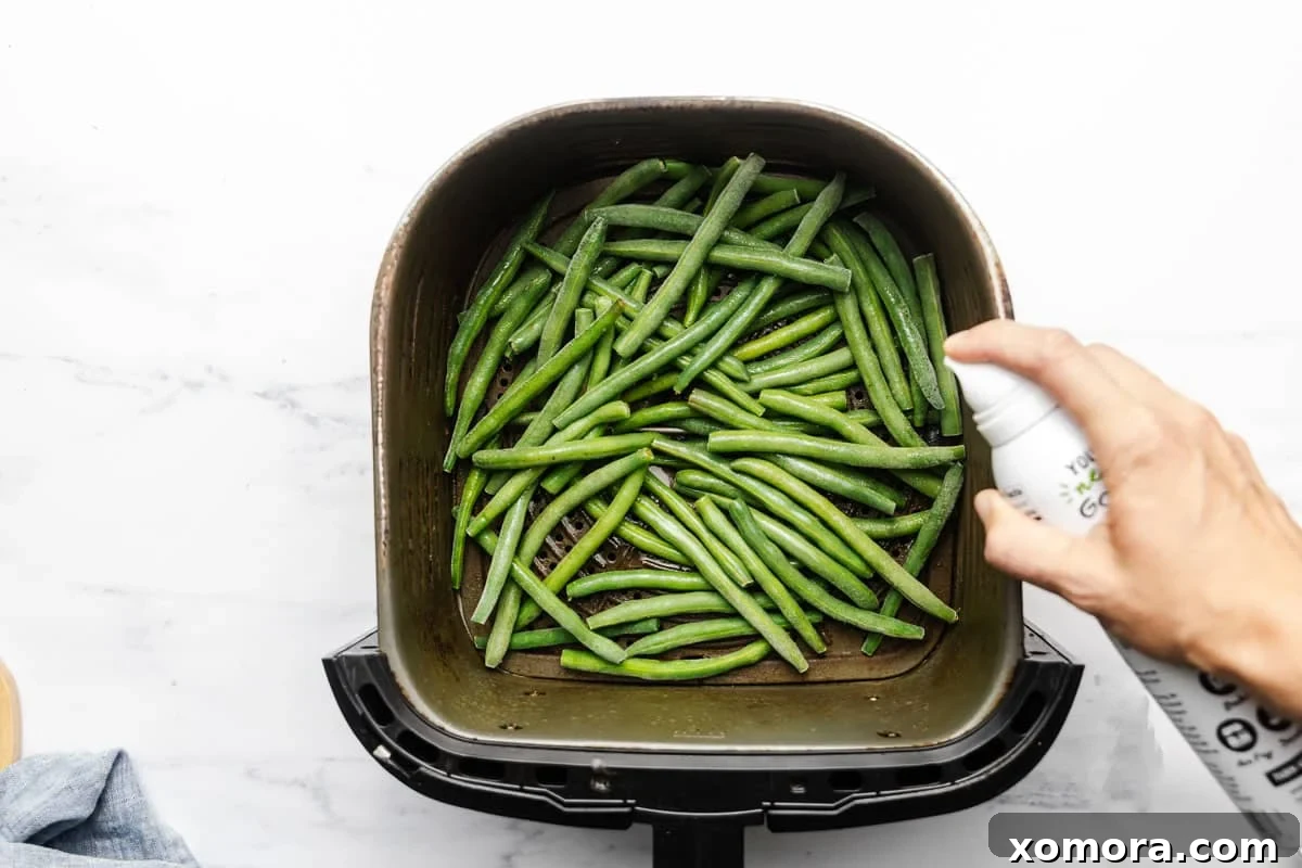 Crispy Air Fryer Frozen Green Beans 3 Close-up of crispy air fried frozen green beans in a bowl.