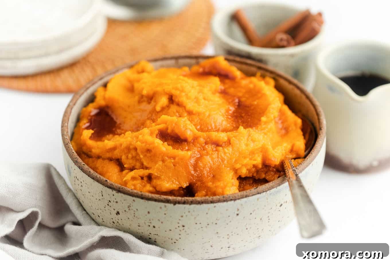 Maple Mashed Sweet Potatoes, smooth and creamy, garnished with cinnamon.