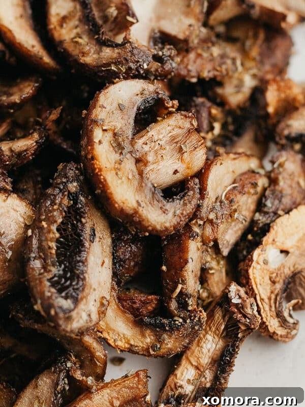 Air Fryer Sliced Mushrooms, golden brown and juicy.