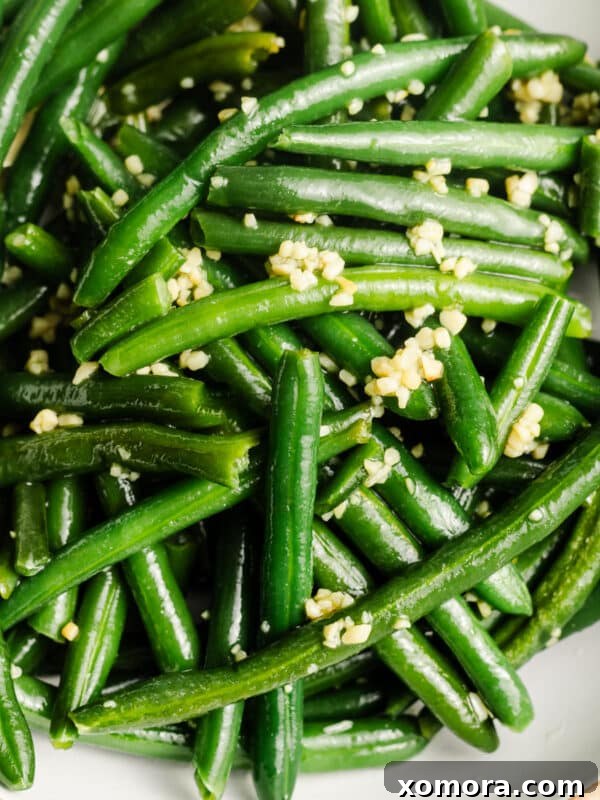 Sautéed Garlic Green Beans, tender and vibrant green, ready to serve.