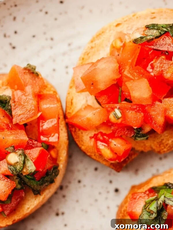 Quick Homemade Bruschetta, topped with fresh tomatoes and basil.