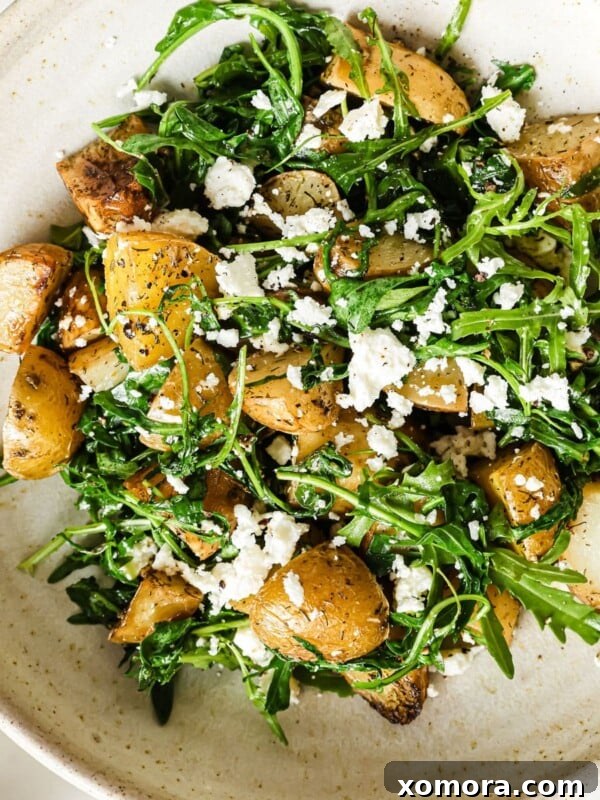 Roasted Potato and Arugula Salad, warm and inviting.