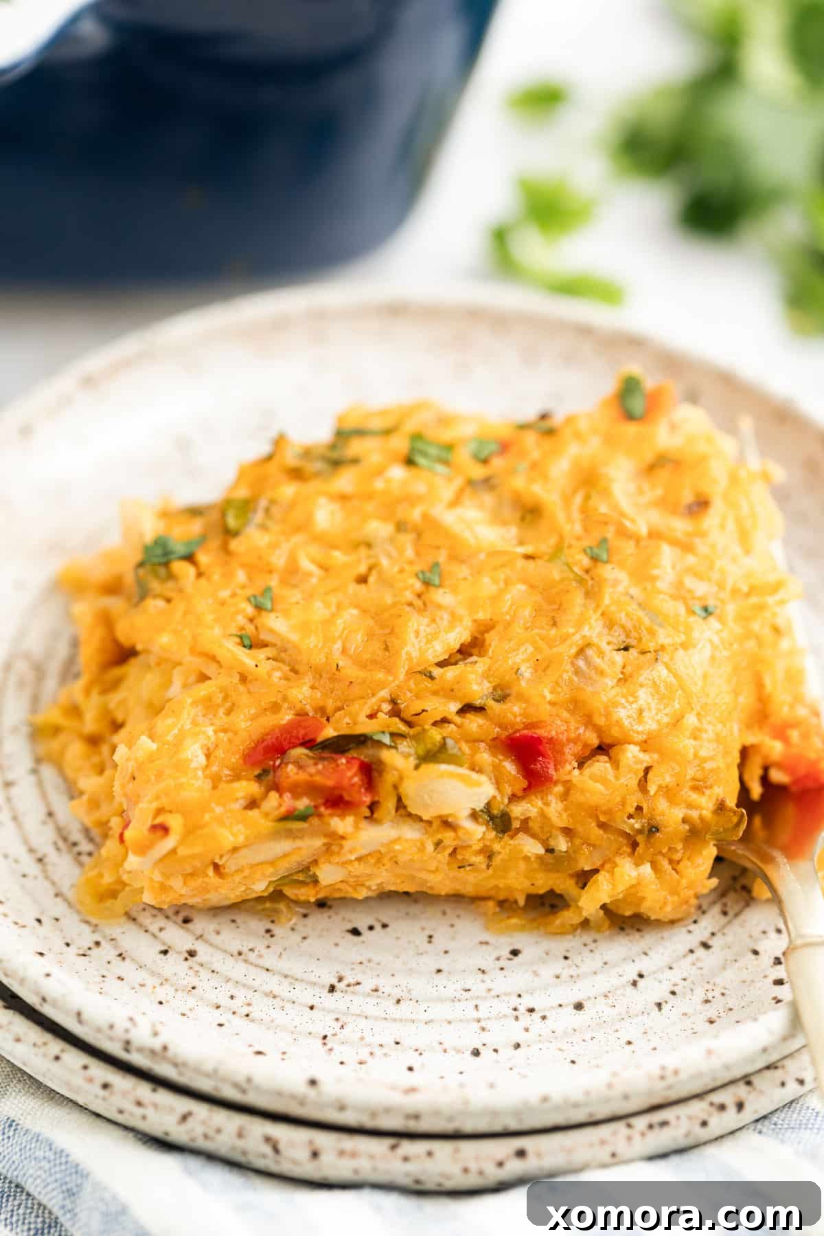 Close-up of Buffalo Ranch Chicken Casserole with visible spaghetti squash strands and chicken.