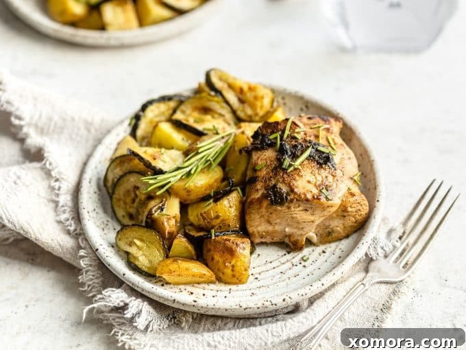 Sheet Pan Chicken with Roasted Potatoes and Zucchini 6 The finished sheet pan dinner with roasted chicken, potatoes, and zucchini, ready to serve.