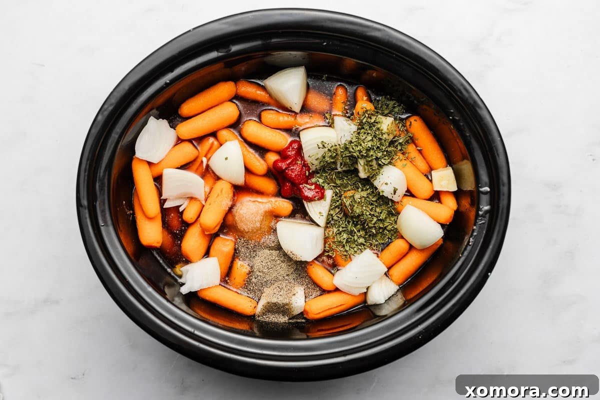 Effortless Slow Cooker Garlic Herb Pot Roast 4 Ingredients for slow cooker garlic herb pot roast laid out on a cutting board.