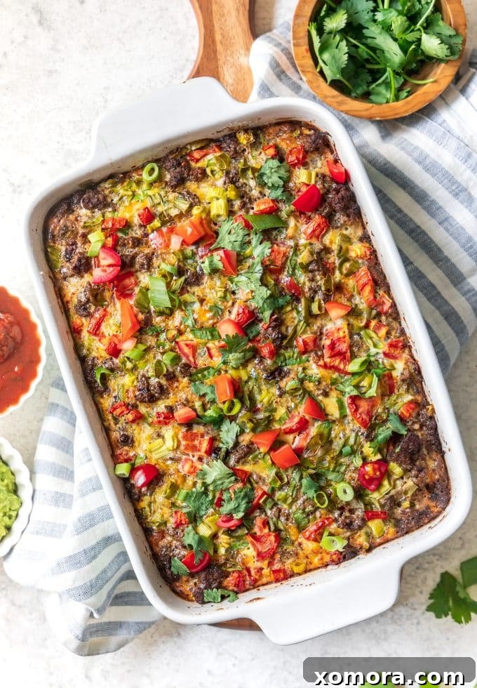 Zesty Plant-Based Mexican Breakfast Bake 5 A cooked Dairy-Free Mexican Breakfast Casserole sliced into portions, ready to be served and garnished with fresh toppings.