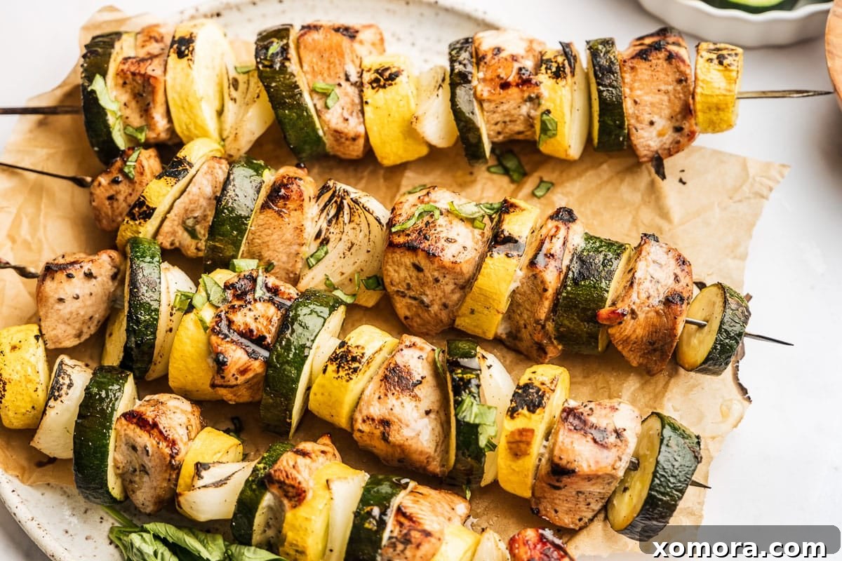 Balsamic Garlic Glazed Chicken Skewers 5 Cooked grilled chicken kabobs on skewers