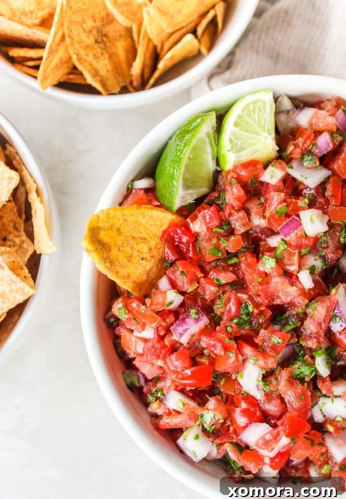 Ingredients for Pico de Gallo laid out on a cutting board, ready for preparation.