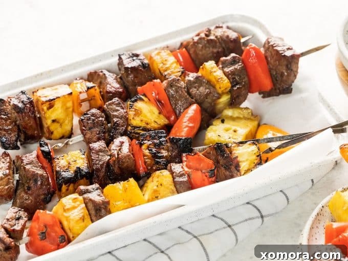 Aloha Grilled Steak Kabobs 4 Close-up of ingredients for Hawaiian Steak Kabobs: top sirloin, coconut aminos, olive oil, sweet mini peppers, pineapple, salt, and pepper.