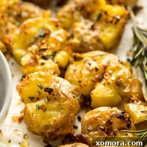Rosemary Garlic Smashed Potatoes, a side dish with crispy texture and herbs.