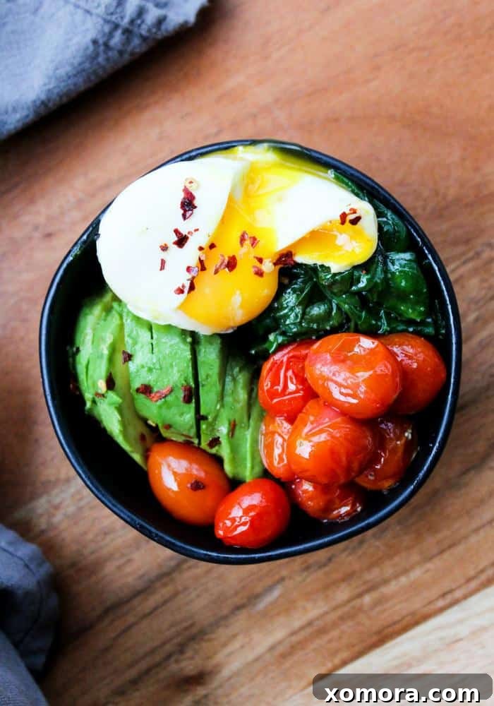 A vibrant and healthy plate of Poached Eggs & Garlic Spinach, perfect for a light meal.